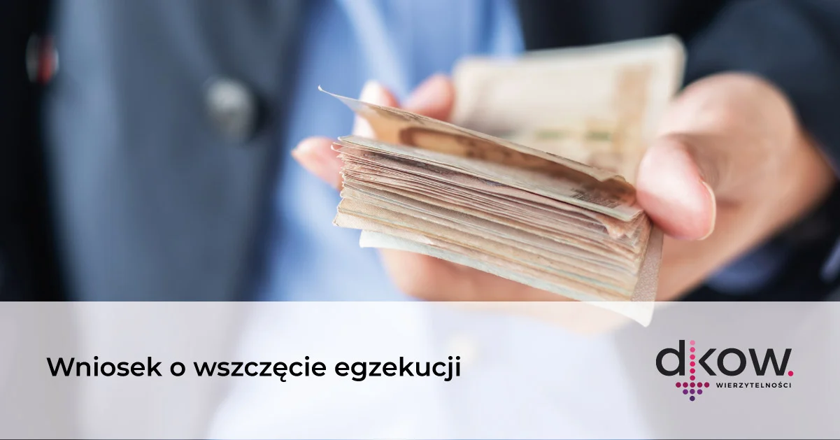 egzekucja-2 reka trzymająca plik pieniędzy